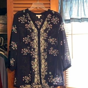 Sheer floral top with quarter sleeves.